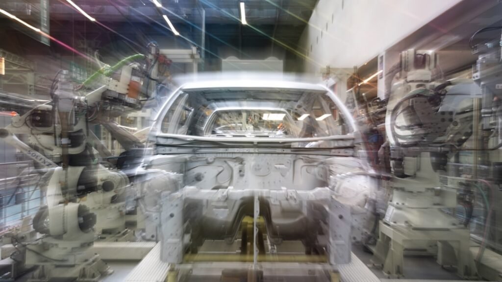robotic manufacturing line representing control engineering skills in AI-driven industrial automation